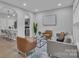 Bright living room featuring contemporary furnishings and an open floor plan at 13115 Meadowmere Rd, Huntersville, NC 28078