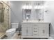 Elegant bathroom featuring a double sink vanity and modern shower at 1326 Anthem Ct, Charlotte, NC 28205