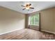 Bright bedroom features wood-look flooring, neutral walls, and a double window at 1326 Anthem Ct, Charlotte, NC 28205