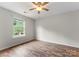 Comfortable bedroom features wood-look flooring and a ceiling fan at 1326 Anthem Ct, Charlotte, NC 28205