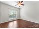 Bright bedroom featuring hardwood floors and a ceiling fan at 1326 Anthem Ct, Charlotte, NC 28205