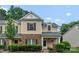 Charming townhome with brick accents and manicured landscaping at 1326 Anthem Ct, Charlotte, NC 28205