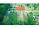 An aerial view showcases 139 Sheep Path Dr, Mooresville, NC 28115, set amidst lush trees and neatly defined parcel lines at 139 Sheep Path Dr, Mooresville, NC 28115