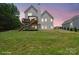 The backyard features a spacious lawn area perfect for outdoor activities and a two-level deck that provides outdoor relaxation at 139 Sheep Path Dr, Mooresville, NC 28115