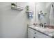Charming powder room with marble countertop sink, stylish fixtures, and decorative shelves at 139 Sheep Path Dr, Mooresville, NC 28115