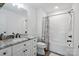 Bathroom with a white shower and white vanity with a granite countertop and black hardware at 139 Sheep Path Dr, Mooresville, NC 28115