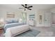 This bedroom features a ceiling fan, carpeted floor, a closet, and an ensuite bathroom at 139 Sheep Path Dr, Mooresville, NC 28115