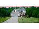Charming two-story home with attached garage, lush lawn, and well-maintained landscaping at 139 Sheep Path Dr, Mooresville, NC 28115