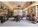 Entertaining game room featuring a round poker table, decorative lighting, and custom shelving for a refined and relaxing atmosphere at 139 Sheep Path Dr, Mooresville, NC 28115