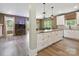 Spacious kitchen with island, stainless appliances, granite countertops, and hardwood floors at 139 Sheep Path Dr, Mooresville, NC 28115