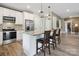 Modern kitchen with stainless steel appliances, granite countertops, and counter chairs at 139 Sheep Path Dr, Mooresville, NC 28115