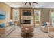 Living room featuring a fireplace, neutral decor, large windows, and plush carpet at 139 Sheep Path Dr, Mooresville, NC 28115