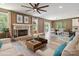 Cozy living room with fireplace, neutral decor, large windows, and hardwood floors at 139 Sheep Path Dr, Mooresville, NC 28115