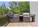 Outdoor kitchen featuring a built-in grill and counter space, perfect for entertaining in the backyard at 139 Sheep Path Dr, Mooresville, NC 28115