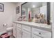 Bathroom featuring granite countertops and a decorative mirror at 154 Tanner Loop, Troutman, NC 28166