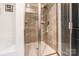 Bathroom boasts a glass-enclosed shower with sleek tilework and modern fixtures at 154 Tanner Loop, Troutman, NC 28166