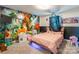 Whimsical bedroom featuring a colorful mural and playful decor at 154 Tanner Loop, Troutman, NC 28166