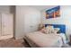 Bright bedroom with a blue bed frame, soft lighting, and ample closet space at 154 Tanner Loop, Troutman, NC 28166
