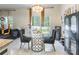 Dining area featuring a glass table, modern chairs, and natural light from sliding glass doors at 154 Tanner Loop, Troutman, NC 28166