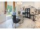 Bright dining area with a modern glass table, leading to a backyard view through sliding doors at 154 Tanner Loop, Troutman, NC 28166