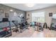 Home gym equipped with a variety of workout equipment and motivational decor at 154 Tanner Loop, Troutman, NC 28166