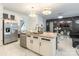 Open-concept kitchen with an island, stainless steel appliances, and modern lighting fixtures at 154 Tanner Loop, Troutman, NC 28166