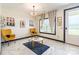 Bright open living room with white tile, windows, and neutral walls at 154 Tanner Loop, Troutman, NC 28166