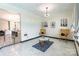 Bright open living room with modern white tile, chairs, and neutral walls at 154 Tanner Loop, Troutman, NC 28166