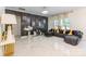 Spacious living room featuring accent wall, modern tile floors and plush seating at 154 Tanner Loop, Troutman, NC 28166