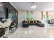 Spacious living room featuring accent wall, modern tile floors and plush seating at 154 Tanner Loop, Troutman, NC 28166