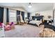 Spacious main bedroom with a luxury bed, large windows, and stylish decor elements at 154 Tanner Loop, Troutman, NC 28166