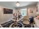 Well-lit office with a modern desk setup and a comfortable seating area at 154 Tanner Loop, Troutman, NC 28166
