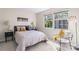 Bright bedroom features two large windows, modern decor, and soft carpet flooring at 1620 #K Arlyn Cir # K, Charlotte, NC 28213