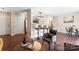 Spacious living area with a bar, view of kitchen, and a cozy seating area with unique chairs at 1620 #K Arlyn Cir # K, Charlotte, NC 28213