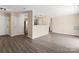 Open concept living room with lots of bright light and gray wood-style flooring at 1620 #K Arlyn Cir # K, Charlotte, NC 28213
