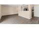Open concept living area shows view of the kitchen with stainless steel appliances at 1620 #K Arlyn Cir # K, Charlotte, NC 28213