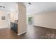 Open concept living area with access to a balcony and view of the modern kitchen at 1620 #K Arlyn Cir # K, Charlotte, NC 28213
