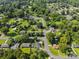 A scenic aerial view of a peaceful neighborhood with mature trees and well-kept lawns at 1632 Kimberly Dr, Gastonia, NC 28052