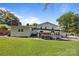 Open backyard featuring multiple patios, trailer storage and lush lawn at 1632 Kimberly Dr, Gastonia, NC 28052