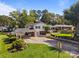 View of a two-story home with a covered parking area and well-maintained landscaping at 1632 Kimberly Dr, Gastonia, NC 28052