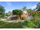 Home's charming brick-accented facade and lush landscaping create an inviting curb appeal at 1632 Kimberly Dr, Gastonia, NC 28052