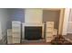 Cozy living room featuring a fireplace and built-in shelving units at 1632 Kimberly Dr, Gastonia, NC 28052