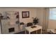 Well-lit office space with a white desk, shelving, window views, and comfortable seating at 1632 Kimberly Dr, Gastonia, NC 28052