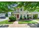 Charming townhome with a well-manicured lawn, tasteful landscaping, and covered front porch at 17729 Trolley Crossing Way, Cornelius, NC 28031