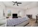 Inviting living area featuring modern decor, a comfy gray couch, and a seamless transition to the dining space at 17729 Trolley Crossing Way, Cornelius, NC 28031