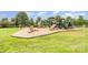 Community playground featuring slides, climbing structures, and swings, designed for outdoor fun at 17729 Trolley Crossing Way, Cornelius, NC 28031