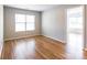 Bright bedroom featuring hardwood flooring and natural light at 2357 Riding Trail Rd, Gastonia, NC 28054