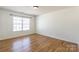 Cozy bedroom with wood flooring and a window, providing a blank canvas for personalized décor at 2357 Riding Trail Rd, Gastonia, NC 28054