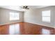 This expansive bedroom provides natural lighting and hardwood flooring at 2357 Riding Trail Rd, Gastonia, NC 28054