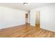 Spacious bedroom with wood flooring leading to a closet offers a flexible and functional living space at 2357 Riding Trail Rd, Gastonia, NC 28054